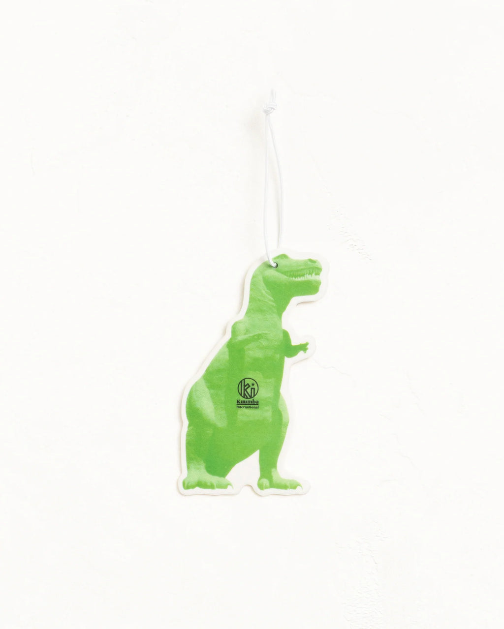 A green dinosaur-shaped air freshener or car air freshener with a white hanging string, shown against a plain white background.