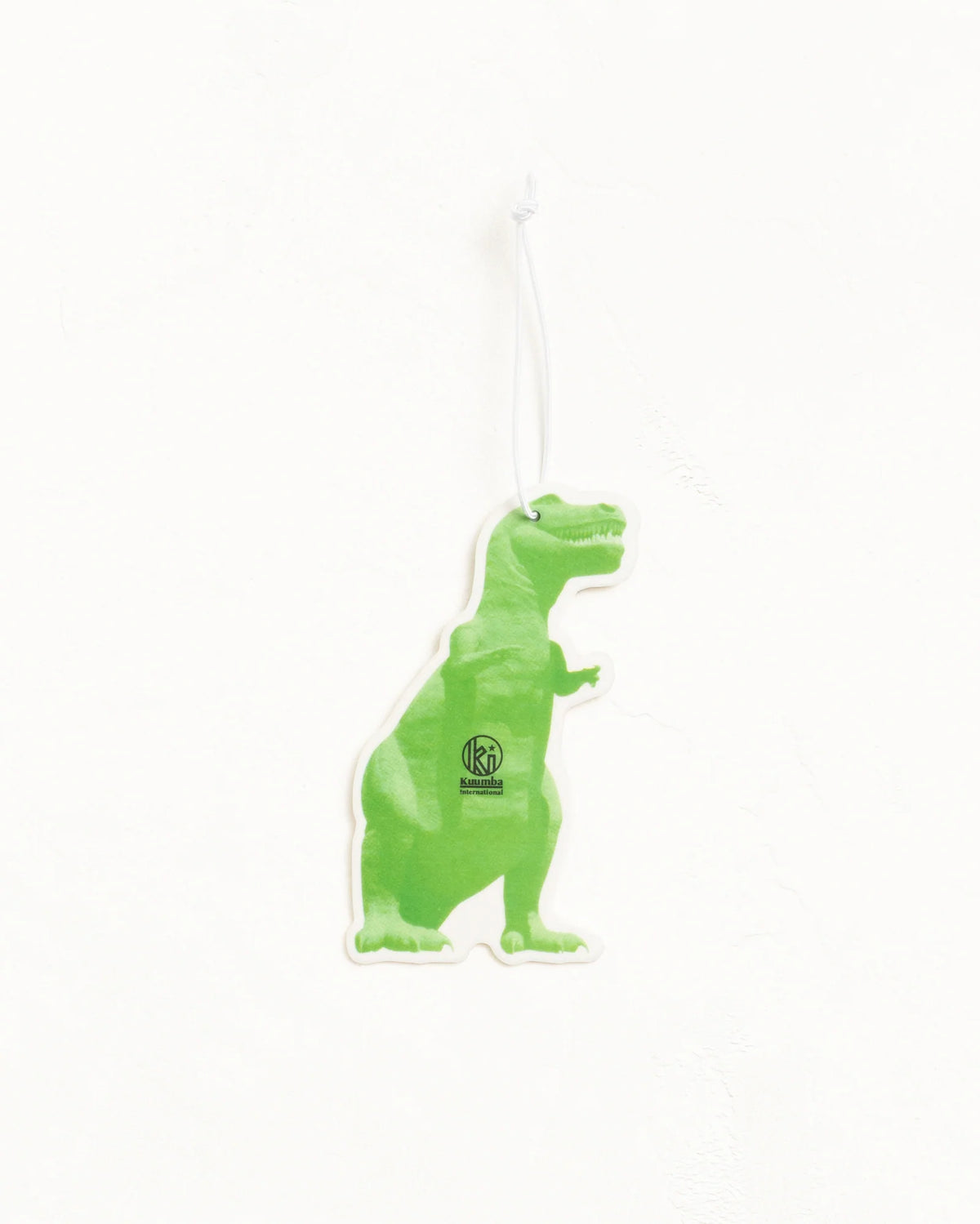 A green dinosaur-shaped air freshener or car air freshener with a white hanging string, shown against a plain white background.