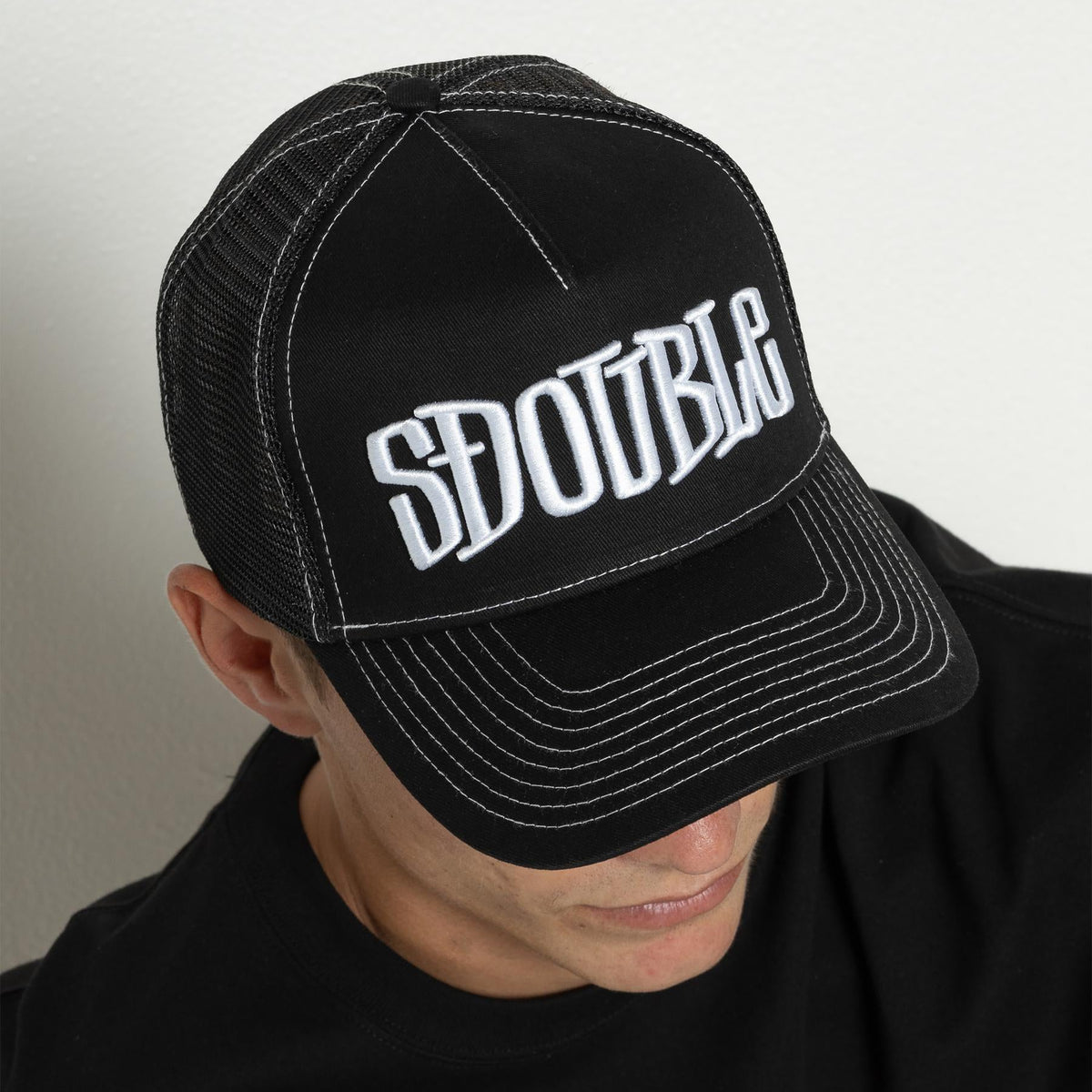S DOUBLE MID-BLOCK CURVED PEAK TRUCKER HAT